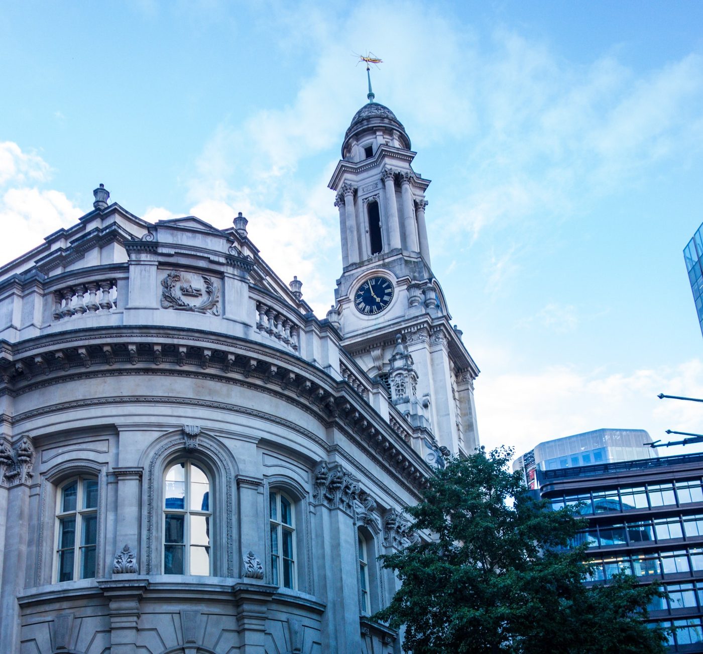 The clock tower and grasshopper weathervane atop the Royal Exchange